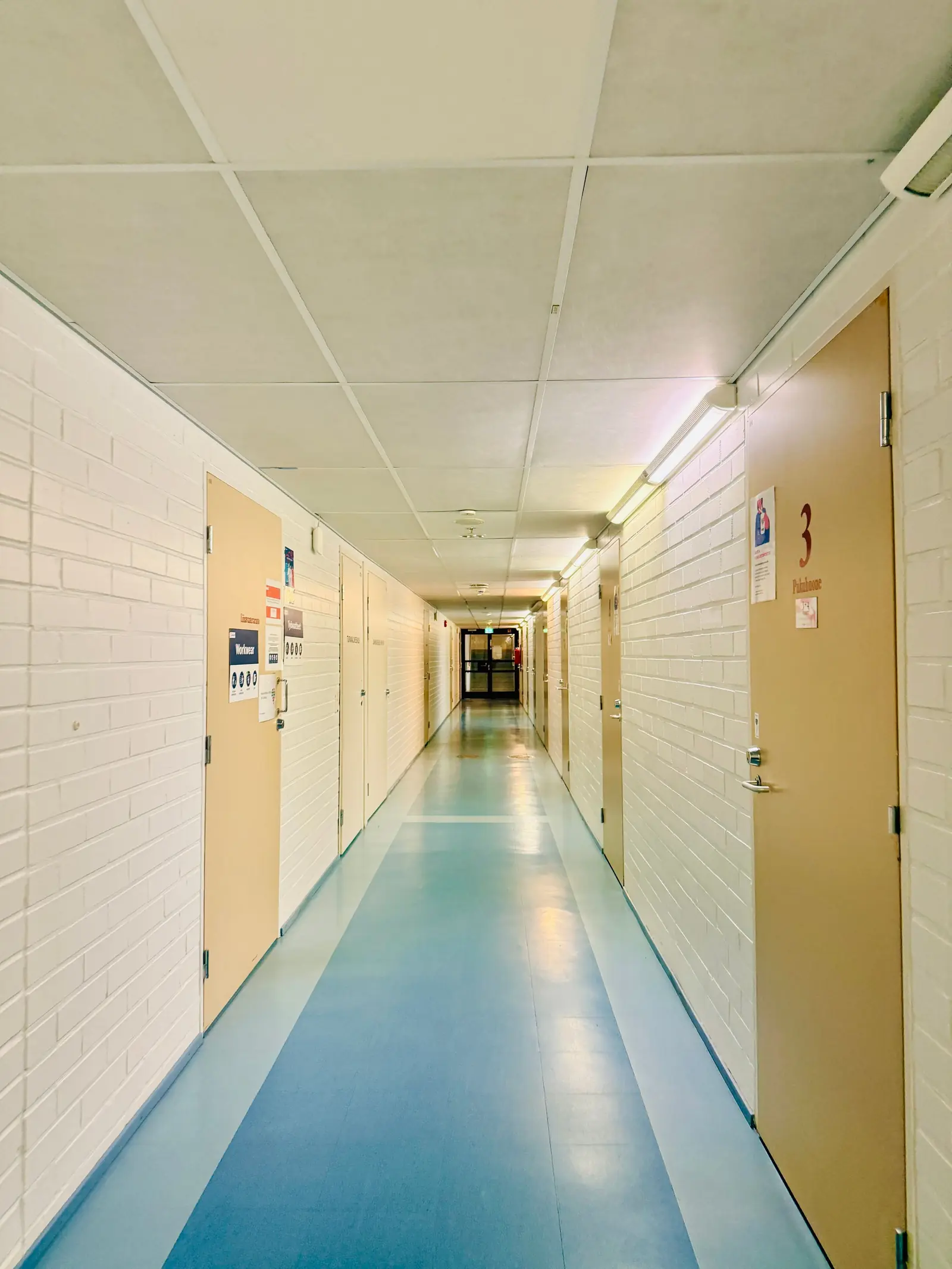 Bright corridor with a seamless blue floor
